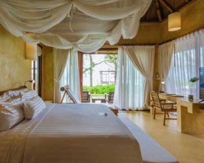 Bedroom Interior of a modern house with a swimming pool, modern pool villa at the beach, indoor view of a uxury villa in Thailand
